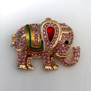 Pink rhinestone and gold elephant pendant.